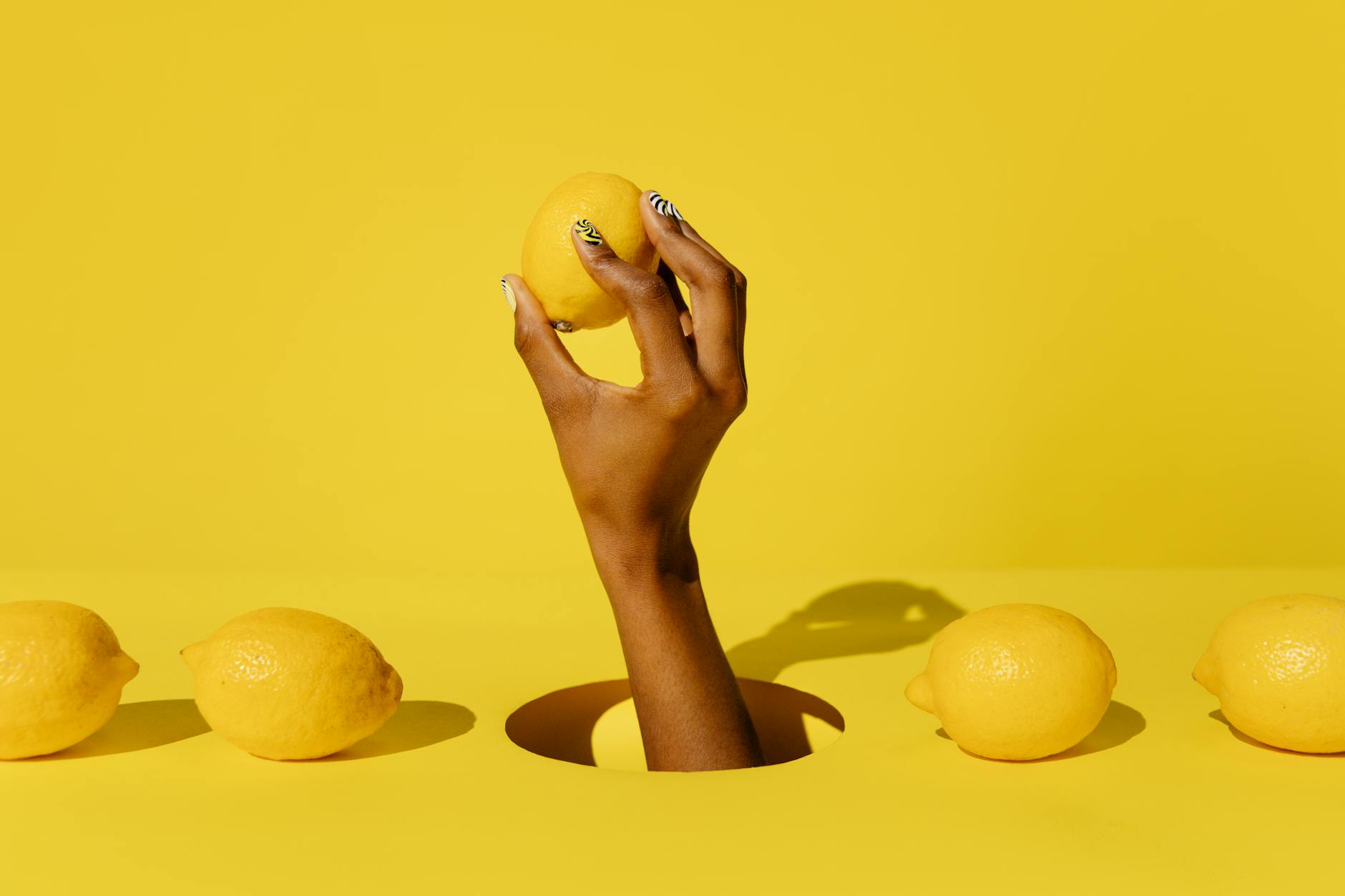 Colorful adult toys displayed on a bright yellow surface, representing variety and openness in partnered pleasure